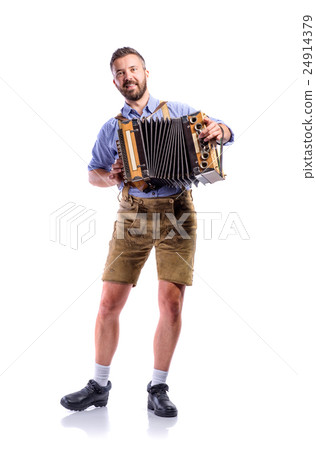Man in traditional bavarian clothes playing 24914379