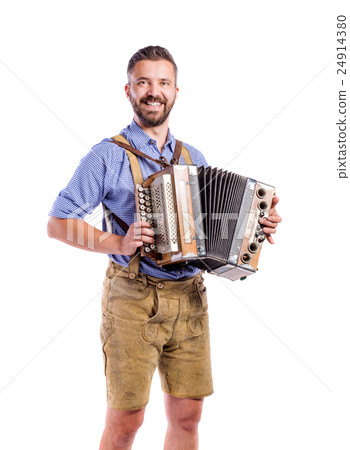 Man in traditional bavarian clothes playing Man in traditional bavarian clothes playing 24914380
