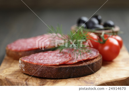 rye bread with salami on olive board rye bread with salami on olive board 24914670