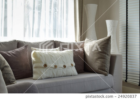 living room with row of grey pillows on sofa living room with row of grey pillows on sofa 24920837