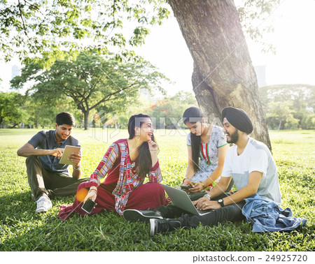 Friends Relaxing Sitting Park Gadgets Concept 24925720