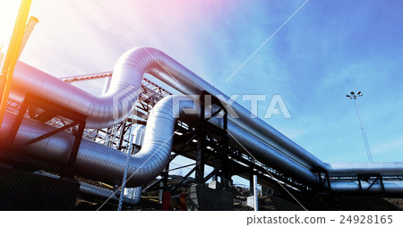 Steel pipelines and valves against blue sky 24928165