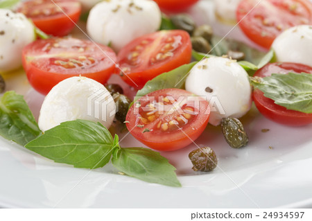 caprese salad with mini mozzarella balls caprese salad with mini mozzarella balls 24934597