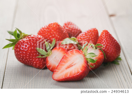 ripe strawberries on an old wooden table 24934613