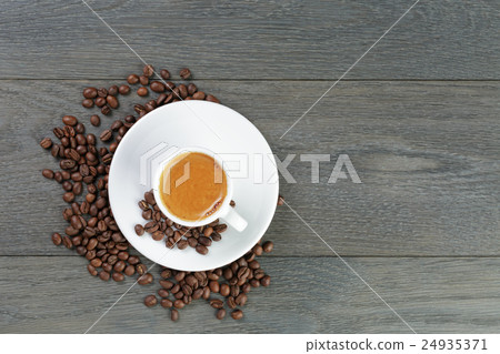 feshly made espresso with coffee beans on wooden  24935371