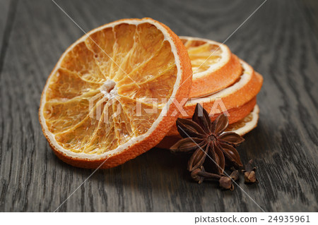 dried orange slices with anise star, on wood table 24935961