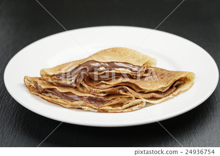 thin crepes or blinis with chocolate cream 24936754