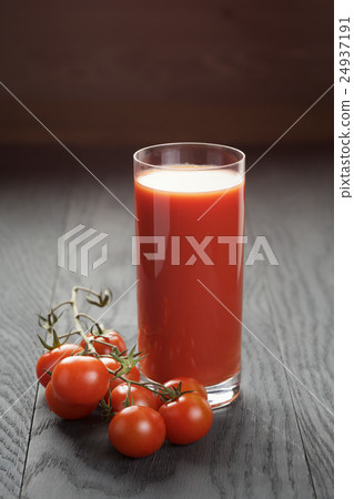 glass of tomato juice on wooden table glass of tomato juice on wooden table 24937191