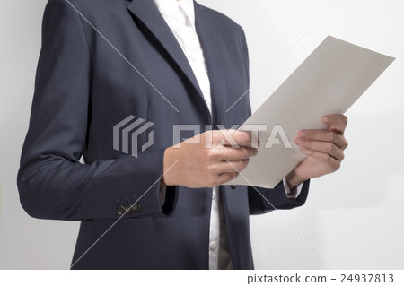 Businesswoman holding document 24937813