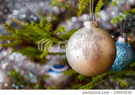 Decoration bauble on decorated Christmas tree Decoration bauble on decorated Christmas tree 24943036