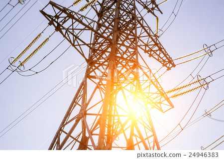 High voltage electric tower line at sunset the sun High voltage electric tower line at sunset the sun 24946383