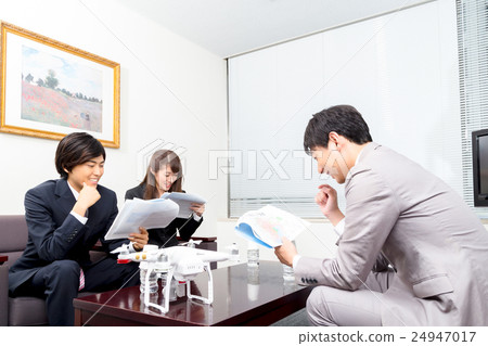 Male employee female employee drone introduction review company unmanned aerial vehicle radio control pilot aircraft quad copter 24947017