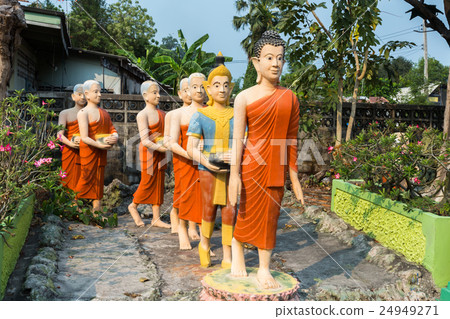 Statues of Buddha and his followers 24949271
