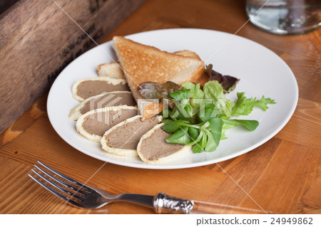 pate sliced on a plate with toast white bread pate sliced on a plate with toast white bread 24949862