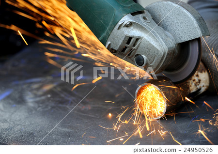 Worker cutting metal with grinder Worker cutting metal with grinder 24950526