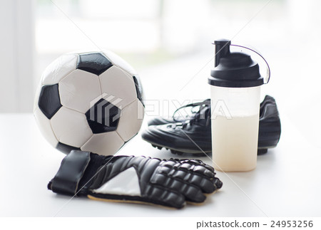 close up of football boots, gloves and bottle 24953256