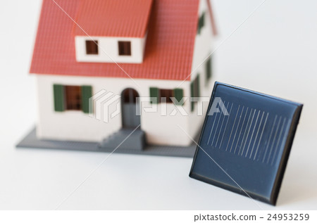 close up of house model and solar battery or cell 24953259