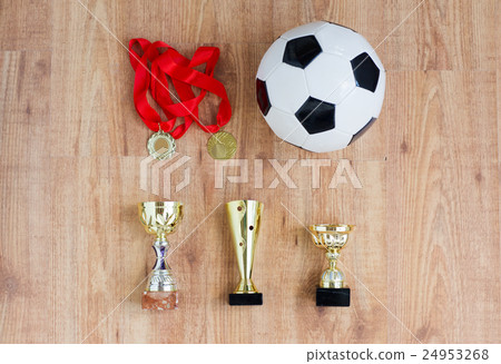 football or soccer ball, golden cups and medals 24953268