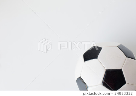 close up of football or soccer ball over white 24953332