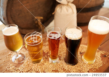 close up of beer barrel, glasses and bag with malt 24953537