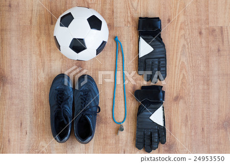 close up of soccer ball, boots, whistle and gloves 24953550