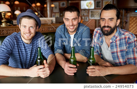 happy male friends drinking beer at bar or pub happy male friends drinking beer at bar or pub 24954073