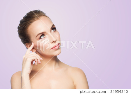 beautiful young woman touching her face beautiful young woman touching her face 24954240
