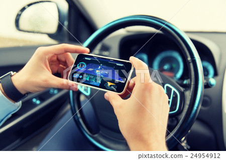 hands with navigator on smartphone in car hands with navigator on smartphone in car 24954912