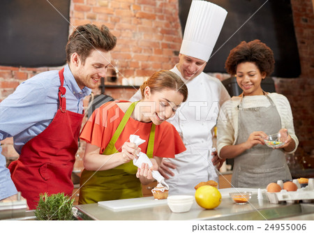 Stock Photo: happy friends and chef cook baking in kitchen