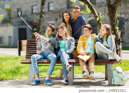 happy teenage students taking selfie by smartphone 24955261