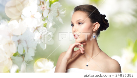 beautiful asian woman with earring and pendant beautiful asian woman with earring and pendant 24955392