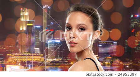 beautiful young asian woman over black background 24955397
