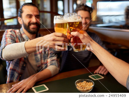 happy male friends drinking beer at bar or pub happy male friends drinking beer at bar or pub 24955409