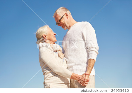 happy senior couple holding hands outdoors happy senior couple holding hands outdoors 24955410