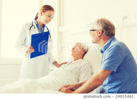 senior woman and doctor with clipboard at hospital 24955491