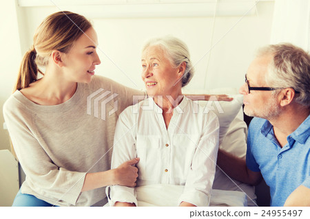 happy family visiting senior woman at hospital happy family visiting senior woman at hospital 24955497