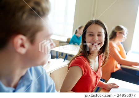 group of happy students talking at school break group of happy students talking at school break 24956077