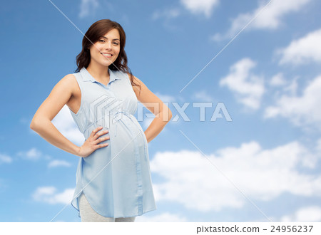 happy pregnant woman touching her big belly happy pregnant woman touching her big belly 24956237
