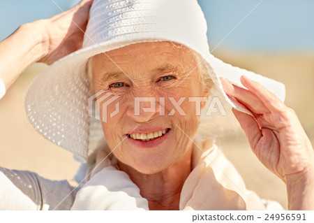 happy senior woman in sun hat on summer beach - Stock Photo [24956591 ...
