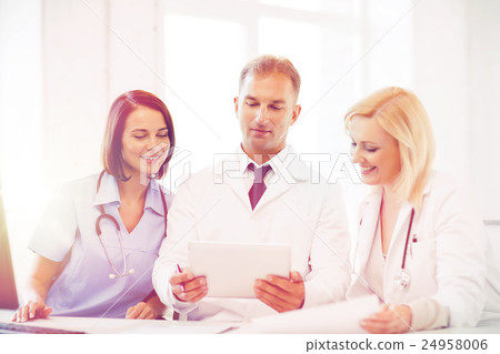 doctors looking at tablet pc doctors looking at tablet pc 24958006