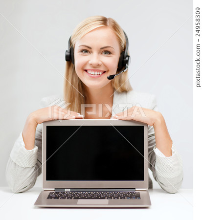 smiling woman with headset and laptop computer smiling woman with headset and laptop computer 24958309