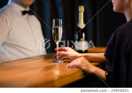 Women drinking bartender and champagne 24958951