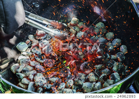 Sparks coming out of a barbecue 24962893