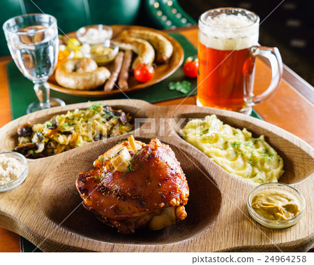 eisbein with braised cabbage, salad and beer 24964258