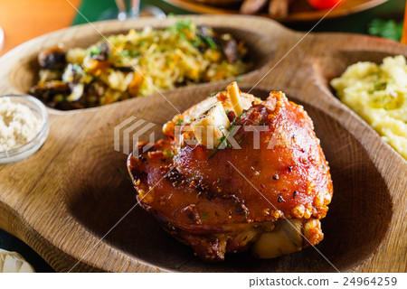 eisbein with braised cabbage, salad and beer 24964259