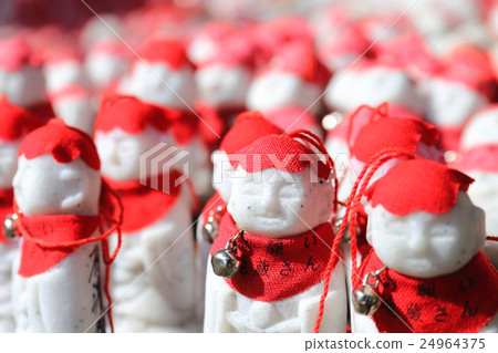 Mr. Jizo wearing a red hat 24964375
