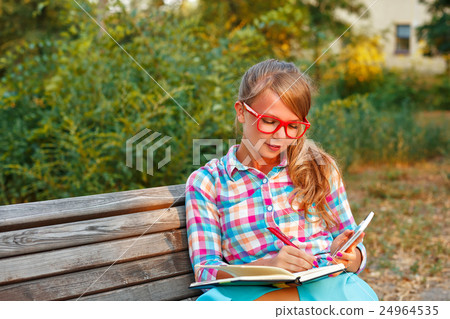 Girl makes notes. Girl makes notes. 24964535