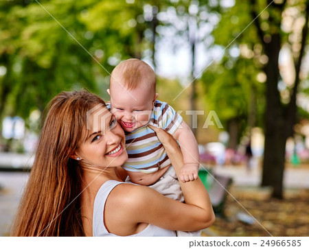 Happy loving mother and her baby son autumn 24966585