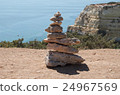Stone pyramid at the sea 24967569