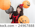 A woman who costumes a Halloween surrounded by a lantern A woman who costumes a Halloween surrounded by a lantern 24967888